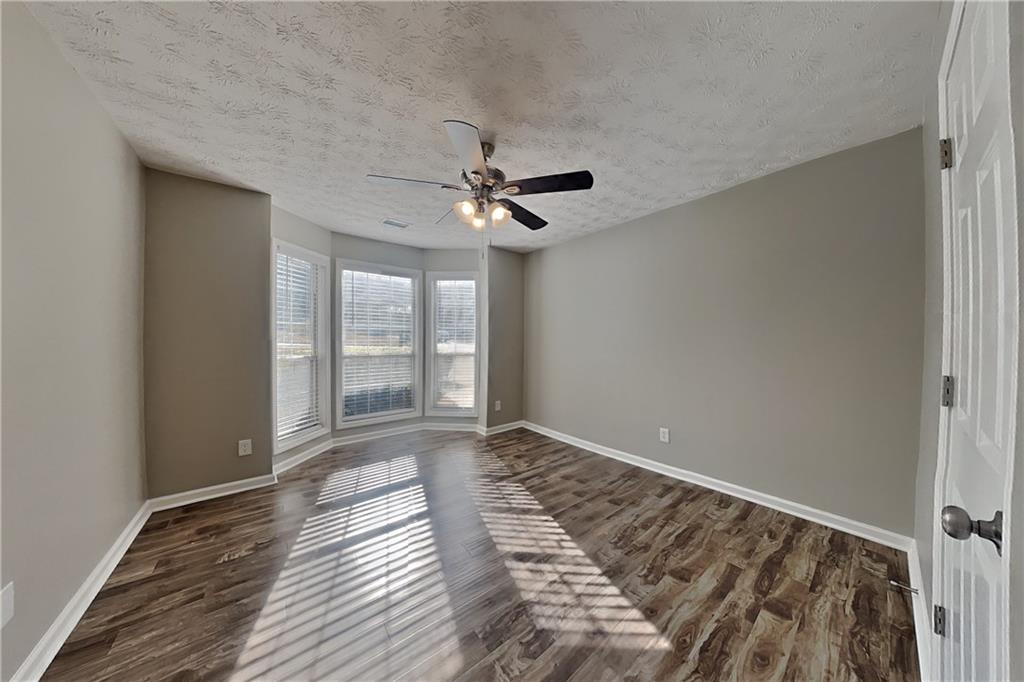 3845 Rajean Drive Lawrenceville, GA 30044 - Photo 12 of 18 a view of an empty room with a window