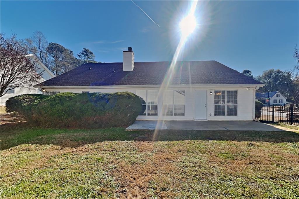 3845 Rajean Drive Lawrenceville, GA 30044 - Photo 17 of 18 a front view of a house with a yard