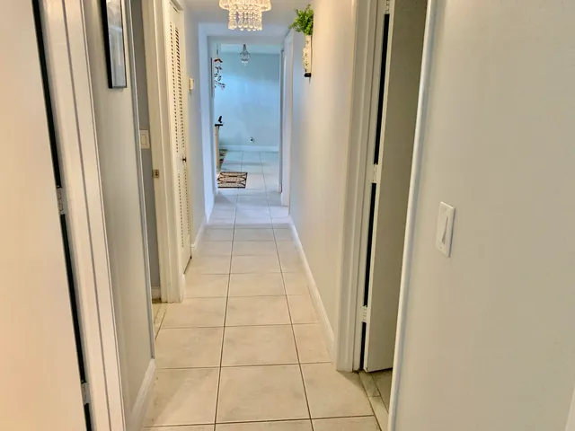 a view of a bathroom from a hallway