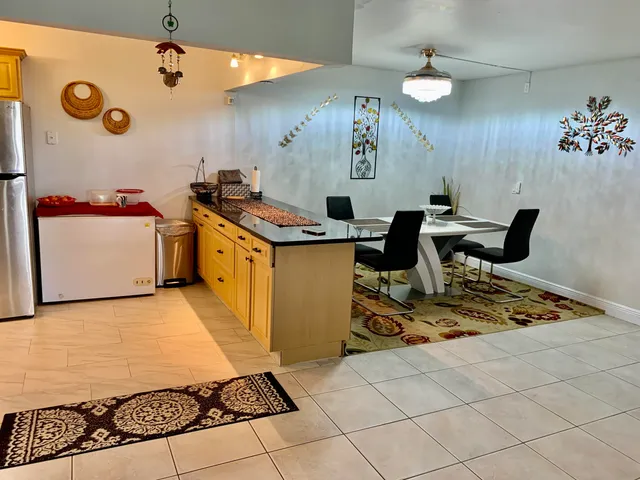 a kitchen with a sink appliances and cabinets