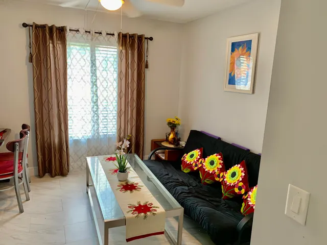 a bed room with furniture and a window