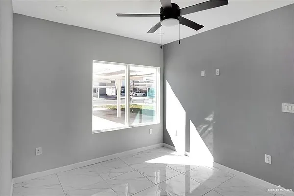 a view of an empty room with a window