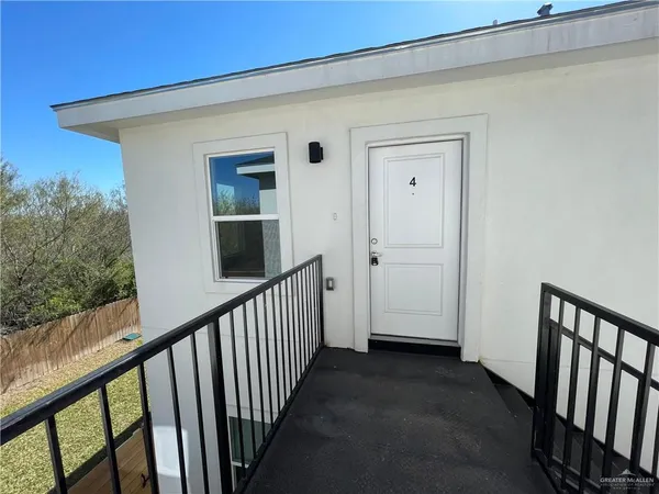 a view of a porch with wooden floor and stairs