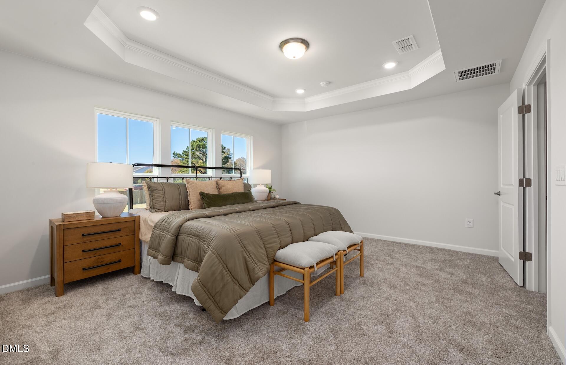 2818 Rodeo Court Fuquay-Varina, NC 27526 - Photo 15 of 30 a spacious bedroom with a bed and window