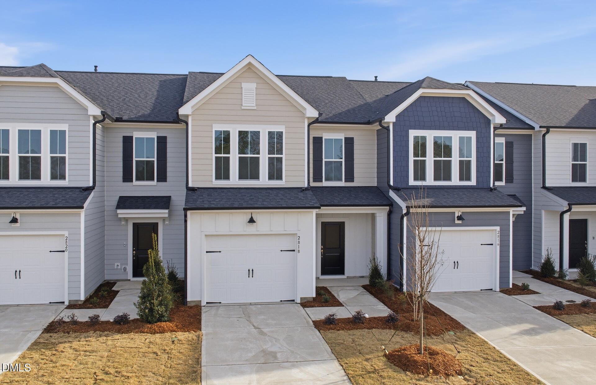 2818 Rodeo Court Fuquay-Varina, NC 27526 - Photo 3 of 30 a front view of a house with a yard