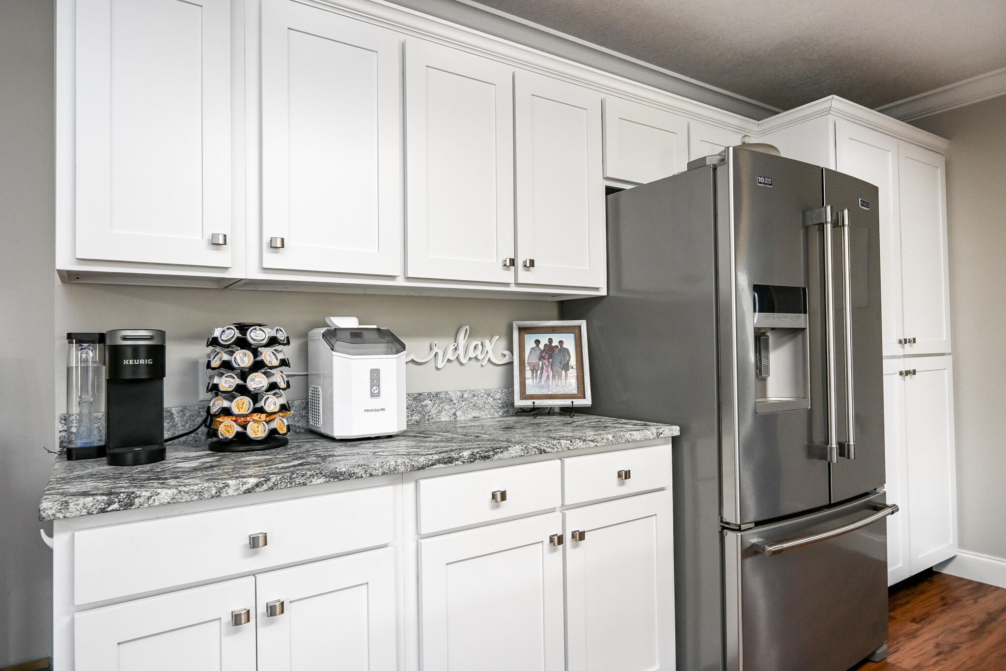 276 Mason Road McDonald, TN 37353 - Photo 23 of 67 a kitchen with granite countertop a refrigerator and cabinets