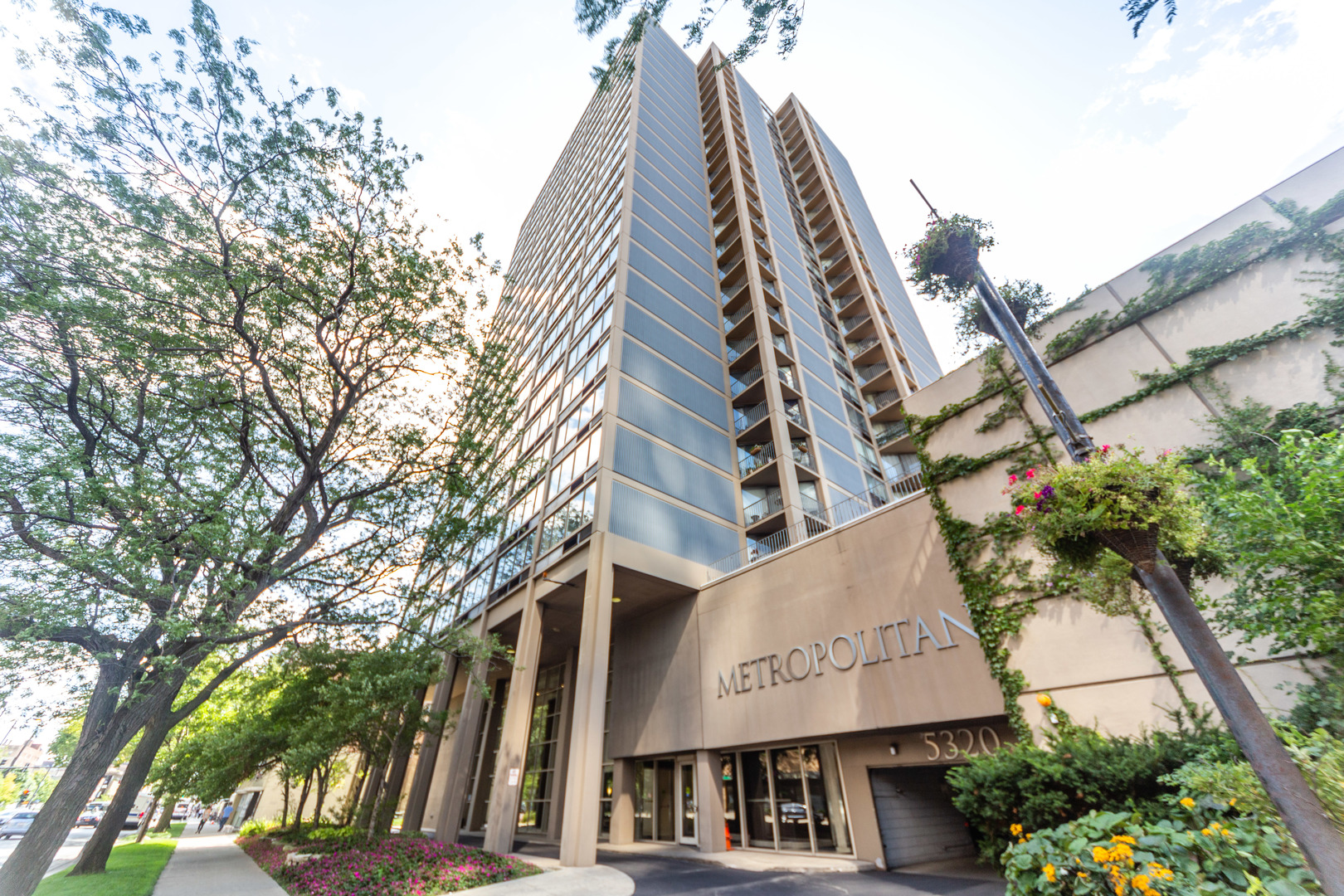 5320 North Sheridan Road, Unit 802 Chicago, IL 60640 - Photo 1 of 26 a view of a large building with large trees