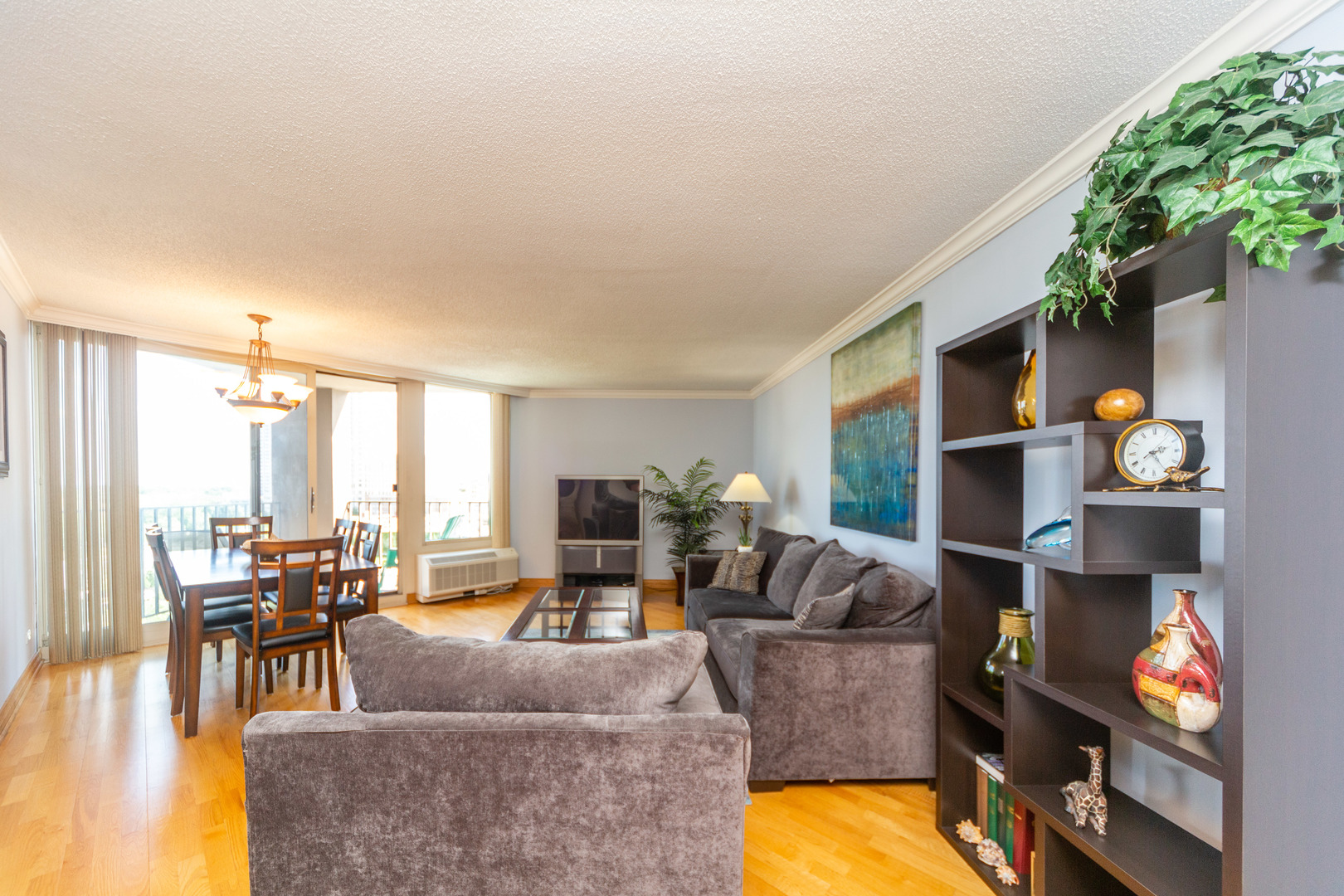 5320 North Sheridan Road, Unit 802 Chicago, IL 60640 - Photo 4 of 26 a living room with furniture and a fireplace