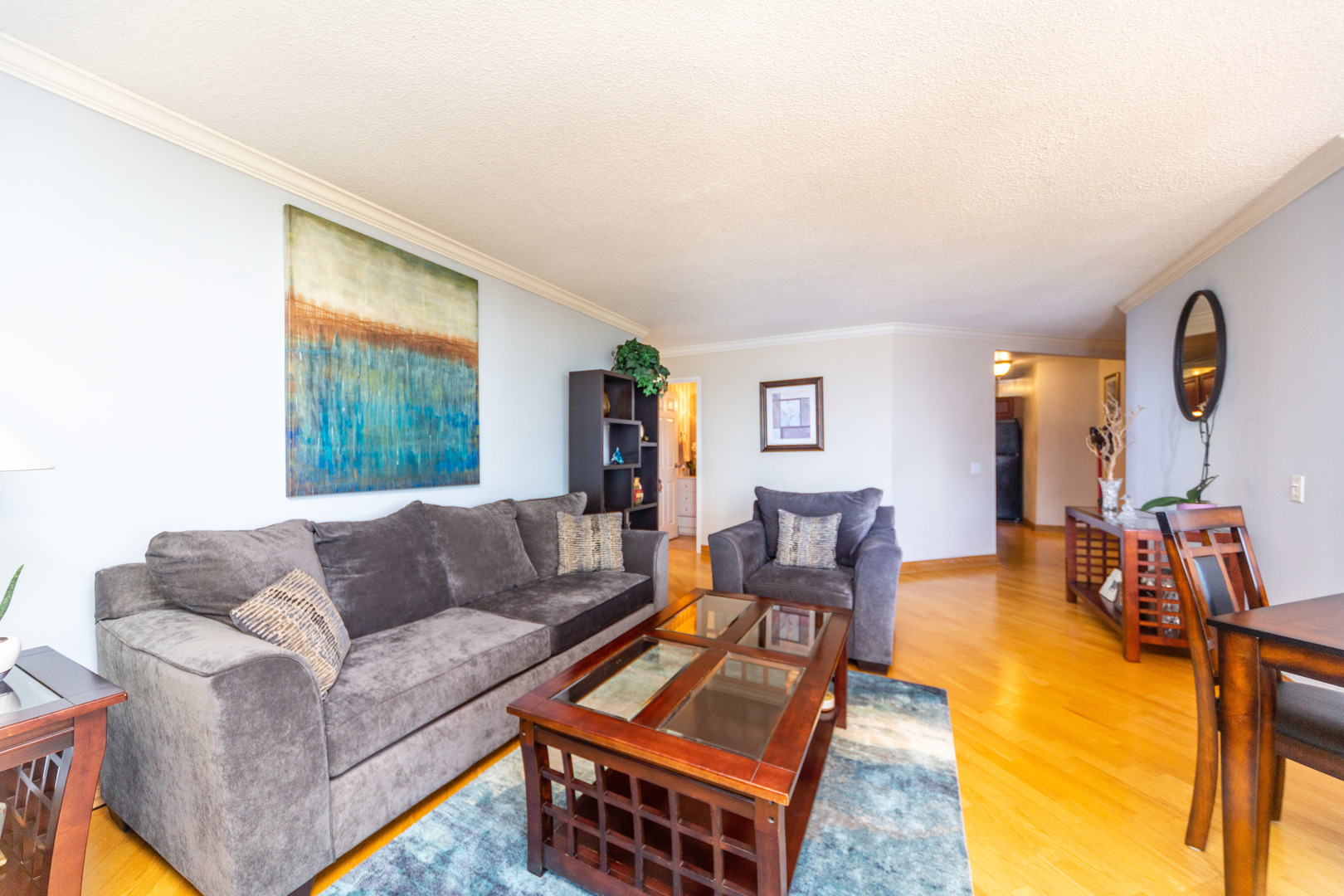5320 North Sheridan Road, Unit 802 Chicago, IL 60640 - Photo 7 of 26 a living room with furniture and a couch