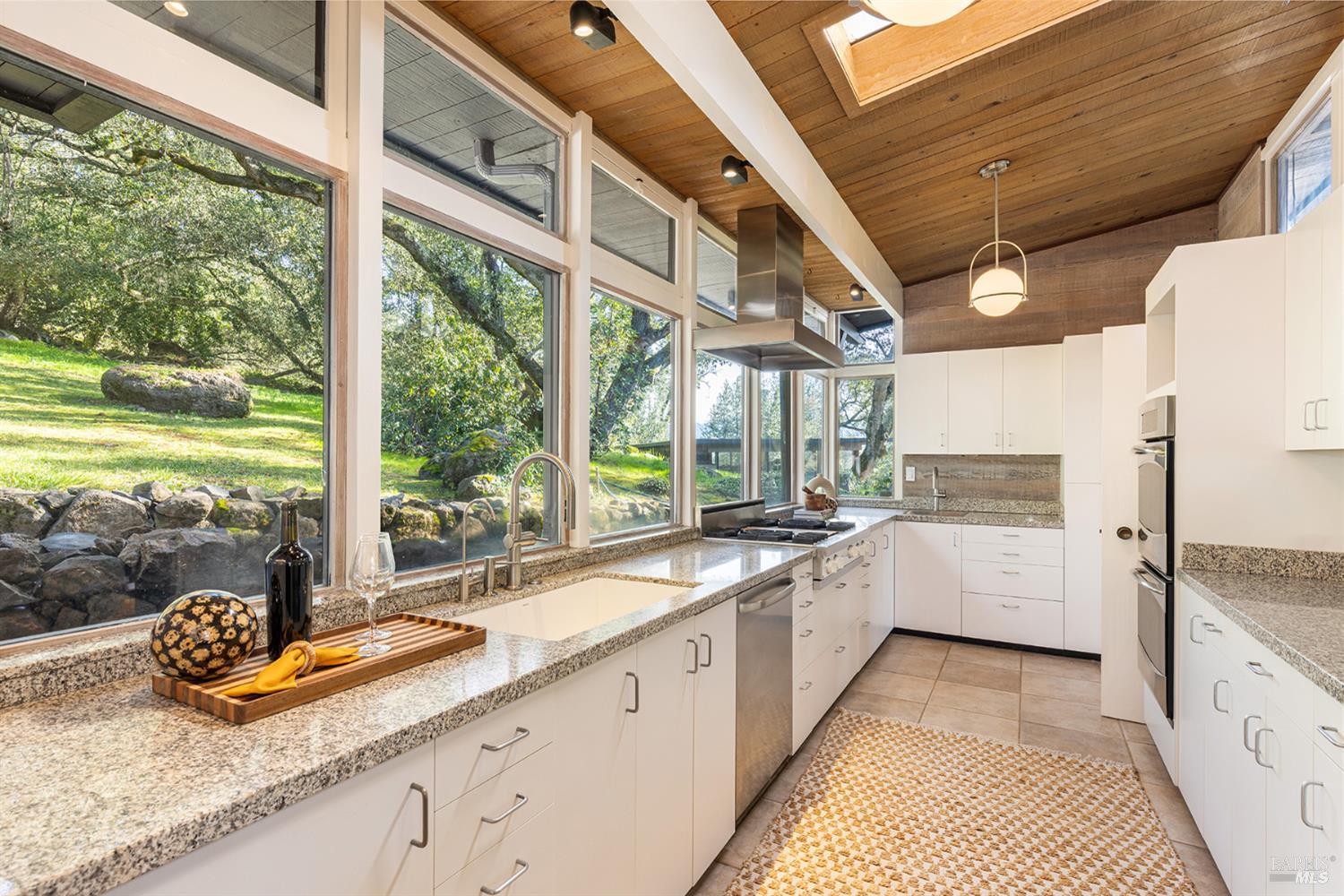 5815 Bennett Valley Road Santa Rosa, CA 95404 - Photo 20 of 50 a large white kitchen with a large window