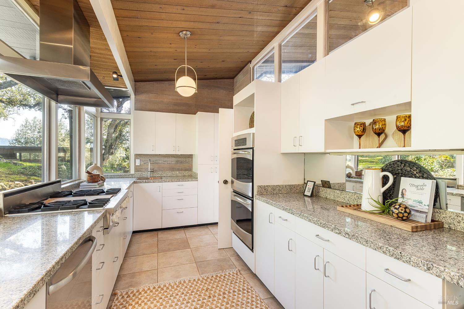 5815 Bennett Valley Road Santa Rosa, CA 95404 - Photo 21 of 50 a kitchen with a sink appliances cabinets and a large window