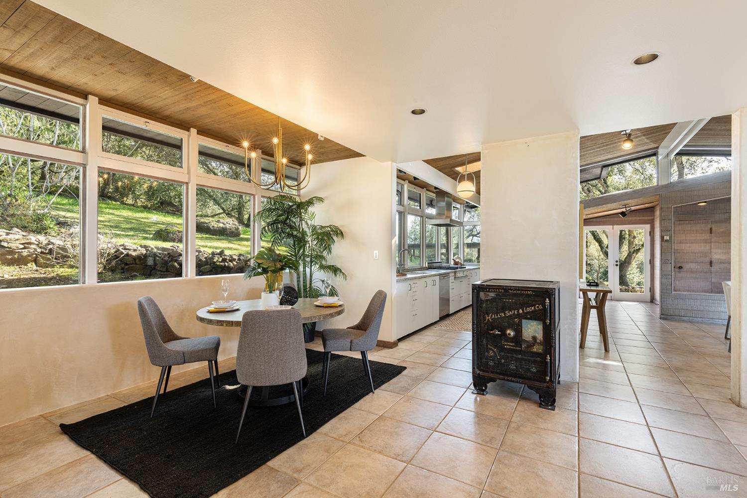 5815 Bennett Valley Road Santa Rosa, CA 95404 - Photo 23 of 50 a dining room with furniture and wooden floor