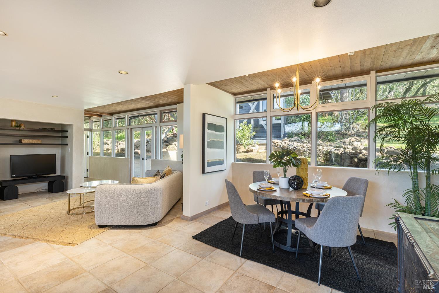 5815 Bennett Valley Road Santa Rosa, CA 95404 - Photo 24 of 50 a dining room with furniture and large windows