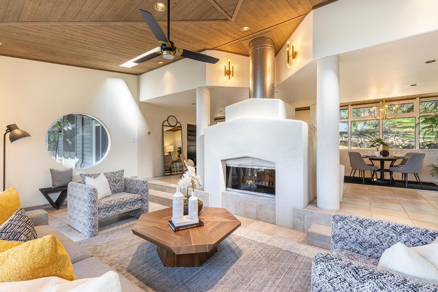 5815 Bennett Valley Road Santa Rosa, CA 95404 - Photo 25 of 50 a living room with furniture and a fireplace