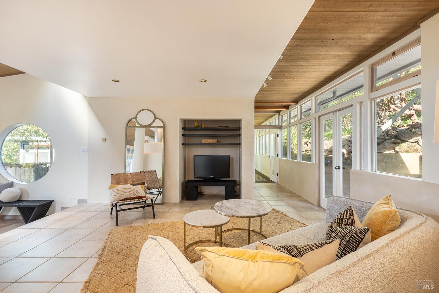 5815 Bennett Valley Road Santa Rosa, CA 95404 - Photo 36 of 50 a living room with furniture a fireplace and a large window