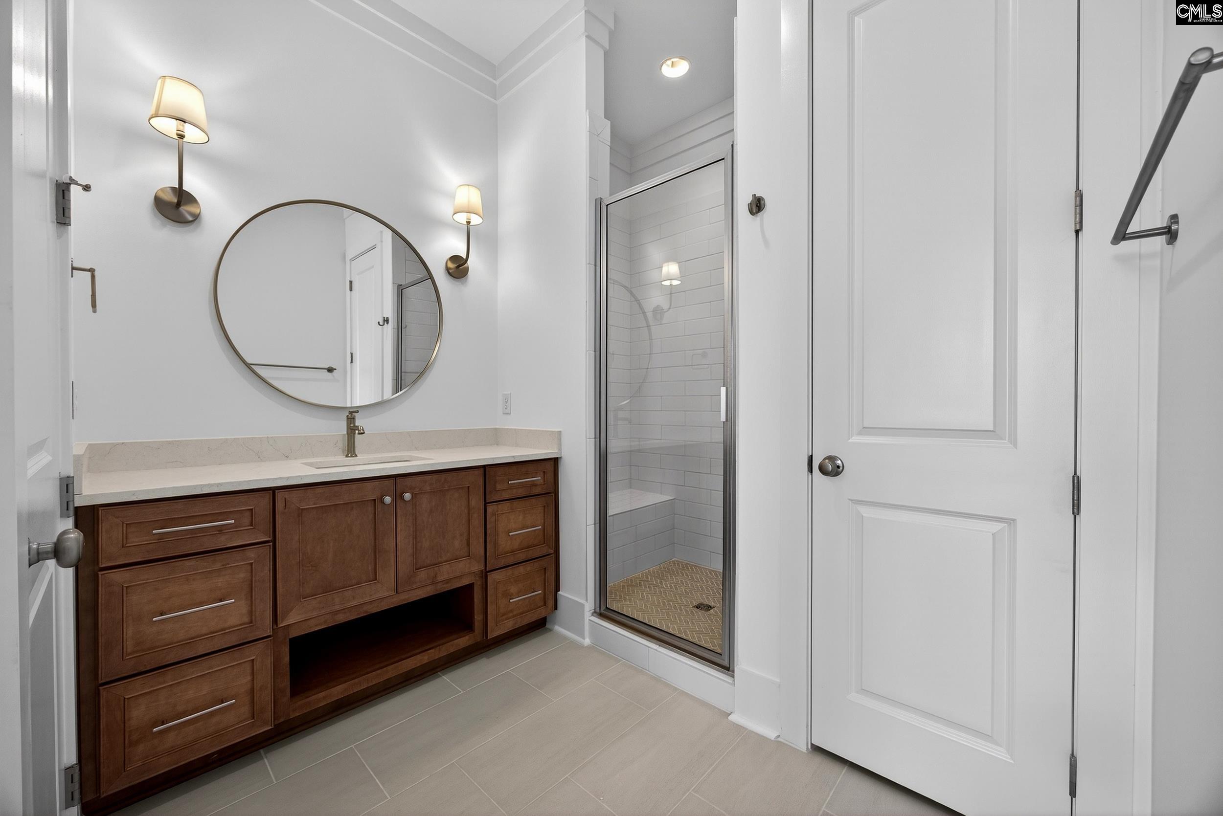 1318 Long Grove Way Lexington, SC 29072 - Photo 68 of 90 a bathroom with a sink a mirror and a shower