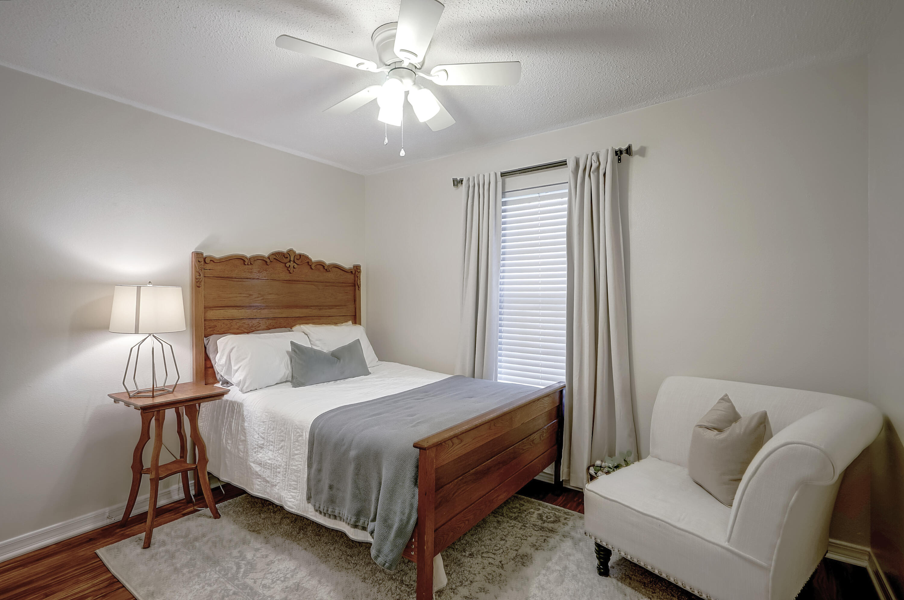 5145 Eagle Way Crestview, FL 32539 - Photo 11 of 15 a bedroom with a bed and a chandelier
