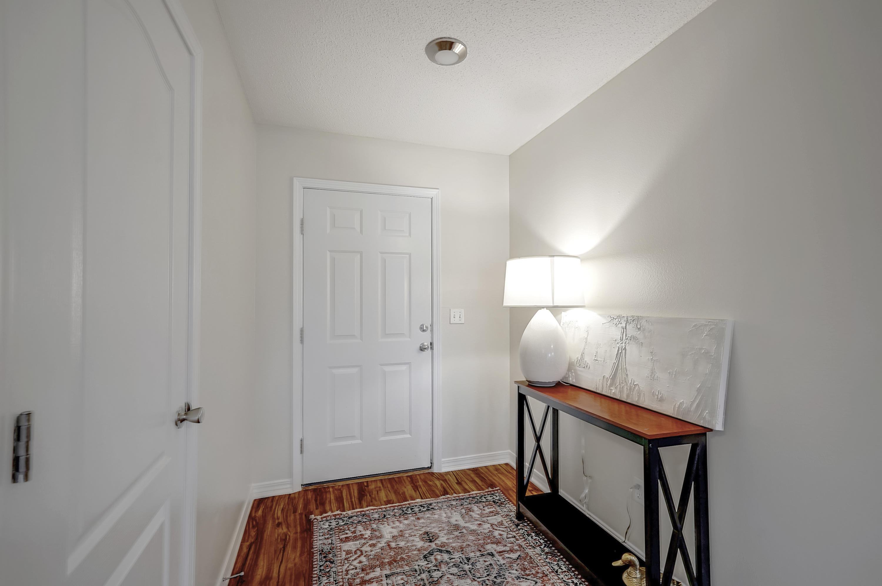 5145 Eagle Way Crestview, FL 32539 - Photo 2 of 15 a view of an entryway with wooden floor