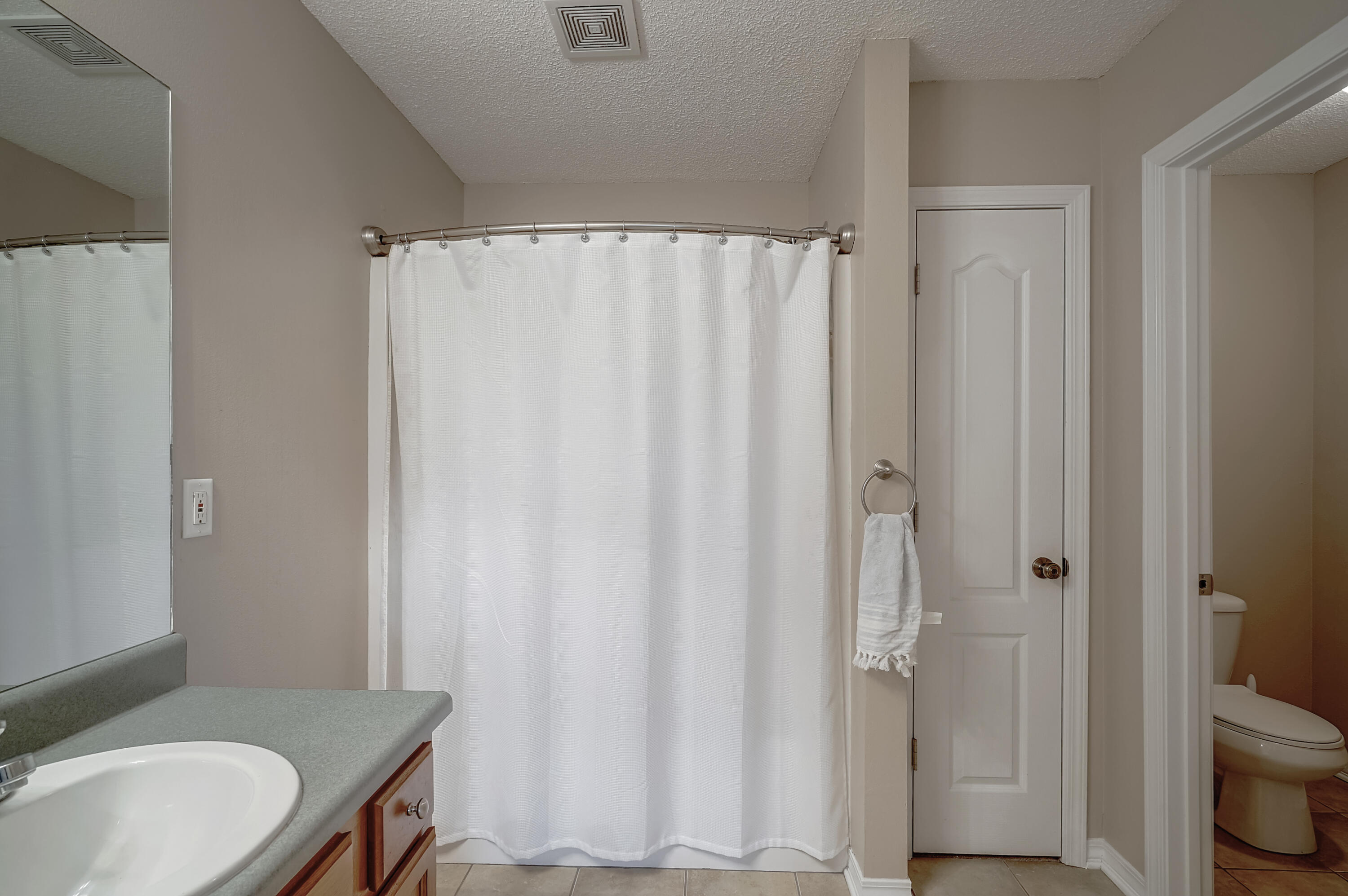 5145 Eagle Way Crestview, FL 32539 - Photo 9 of 15 a bathroom with a sink toilet and shower