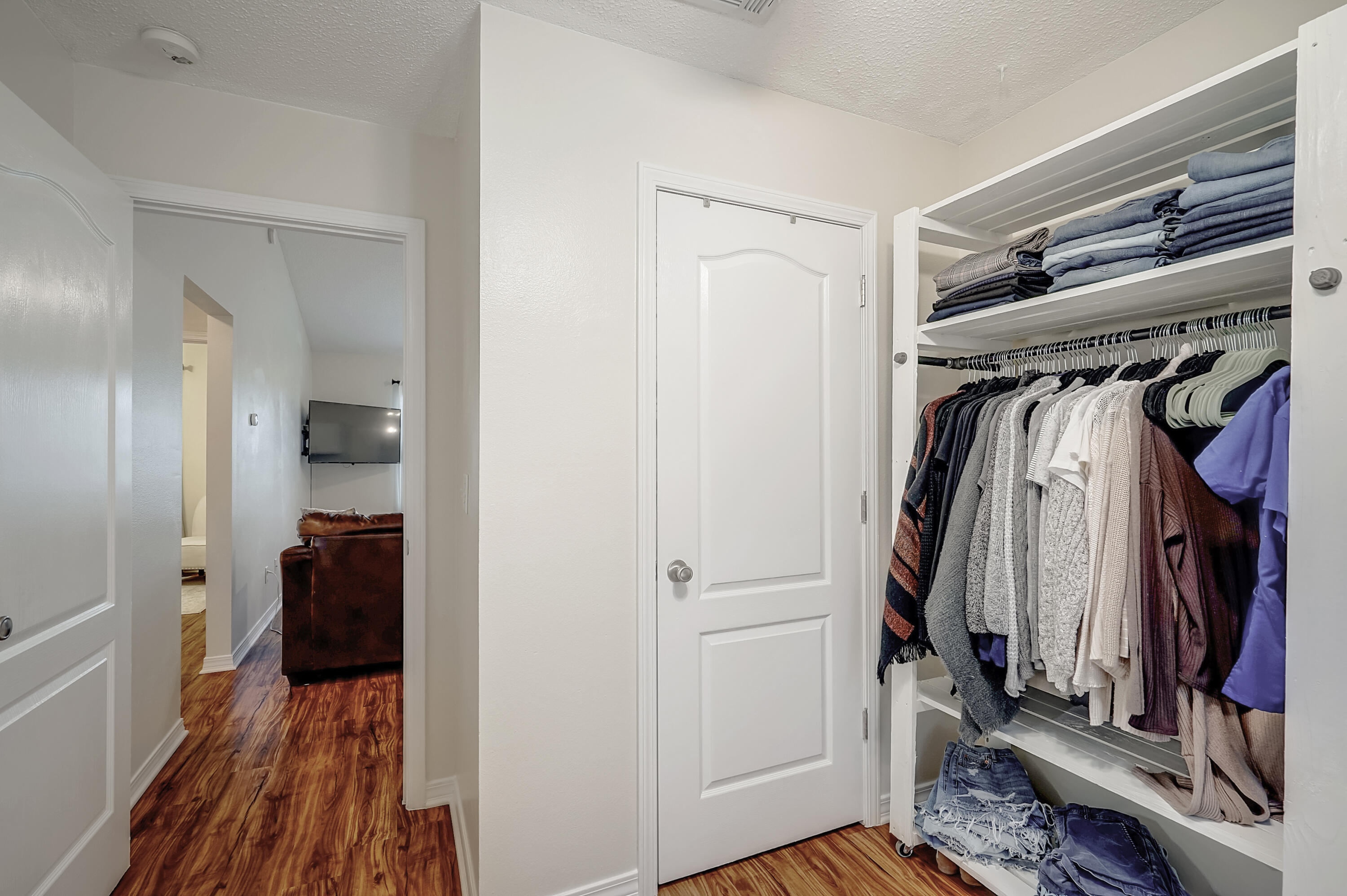 5145 Eagle Way Crestview, FL 32539 - Photo 10 of 15 a view of walk in closet with clothes and shoes