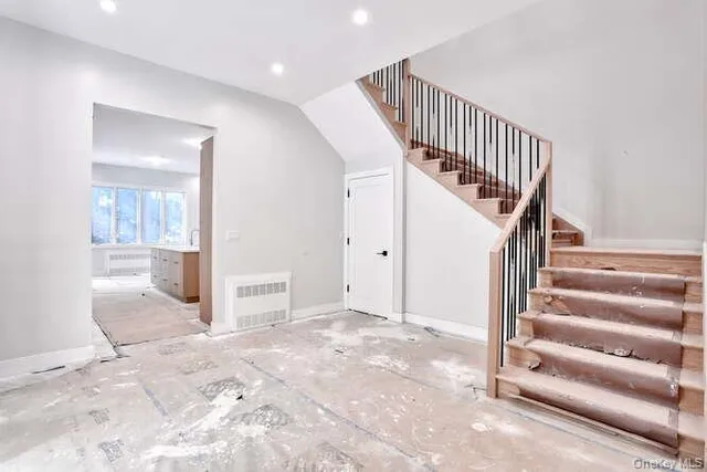 a view of a hallway with staircase