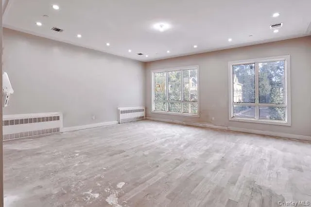 a view of an empty room with windows