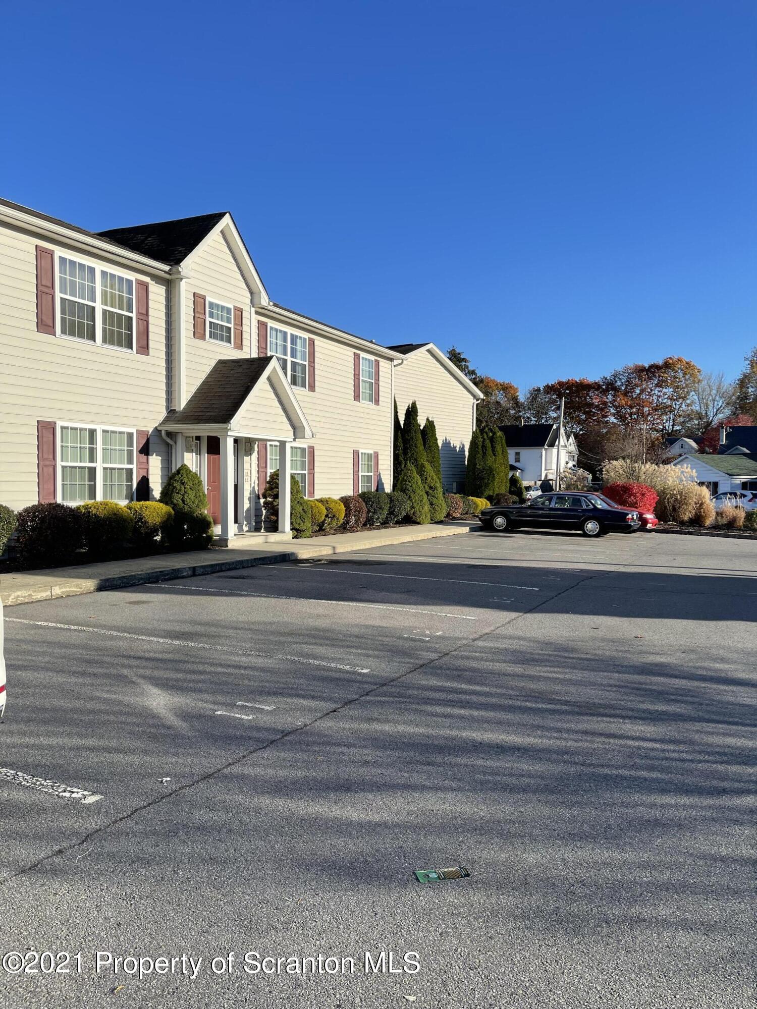 253 Elm Street Moosic, PA 18507 - Photo 1 of 15 a view of street along with residential houses