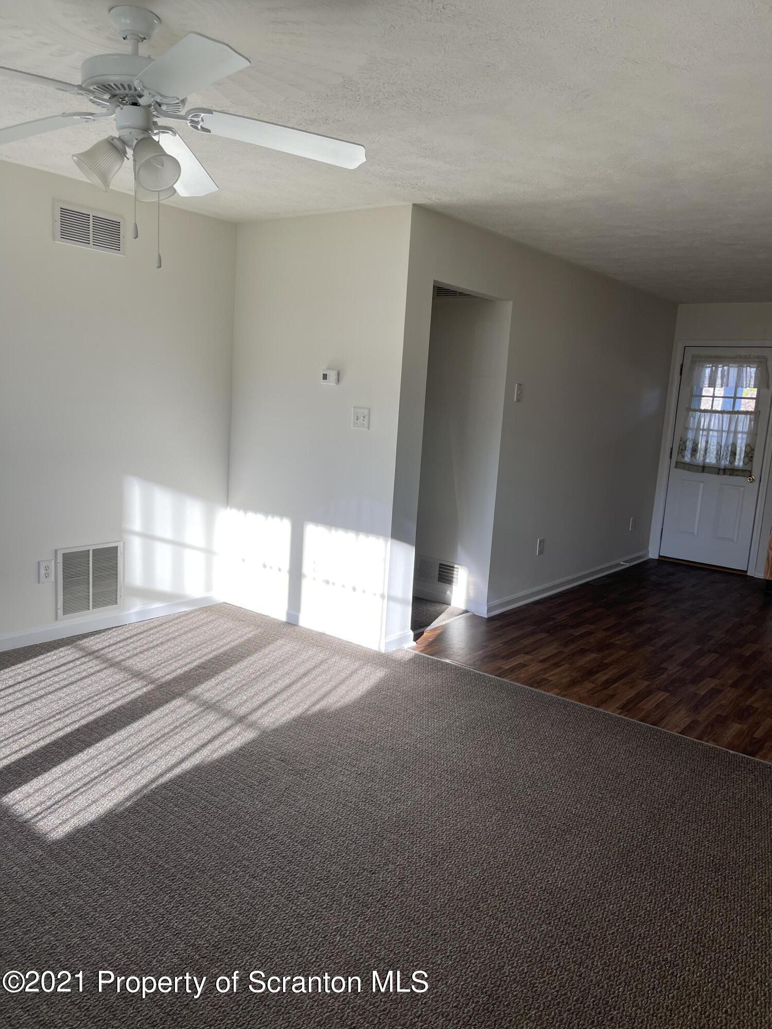 253 Elm Street Moosic, PA 18507 - Photo 15 of 15 a view of empty room with window and ceiling fan