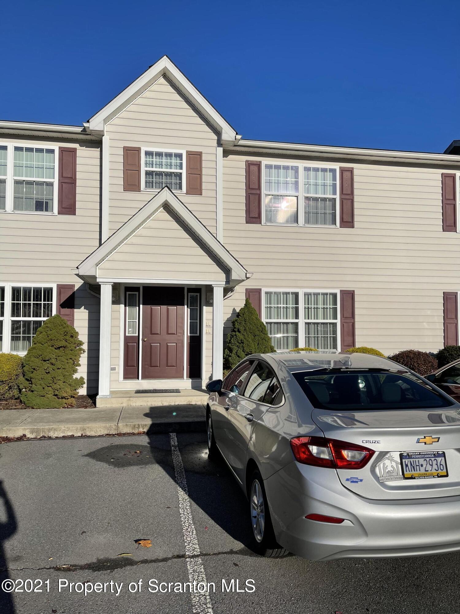 253 Elm Street Moosic, PA 18507 - Photo 5 of 15 a car parked in front of a house
