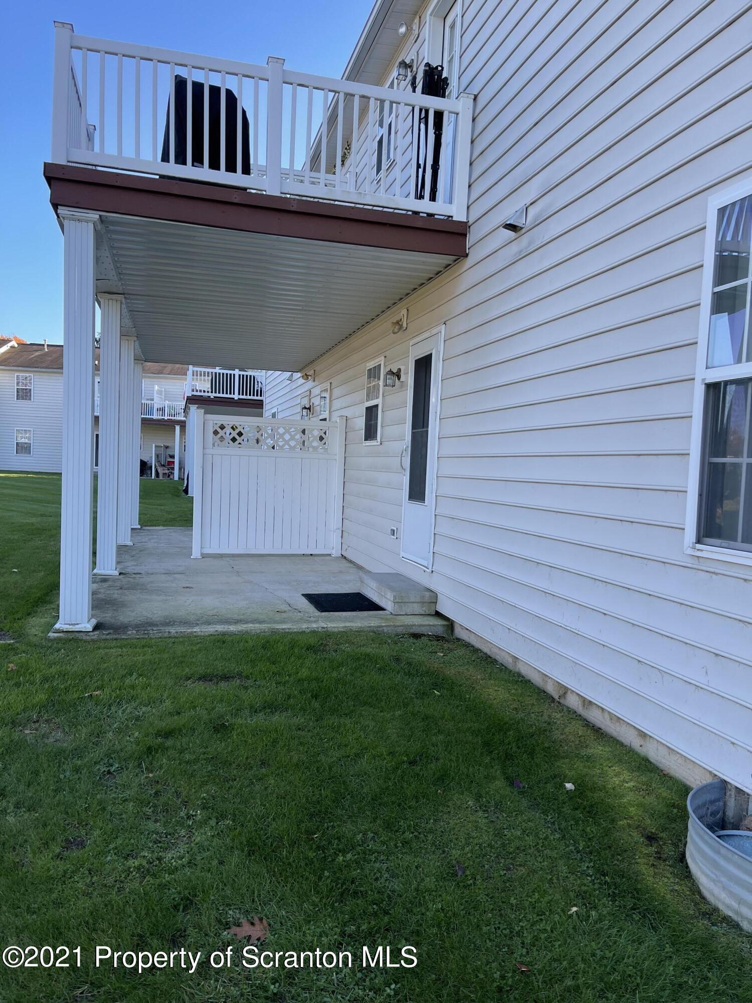 253 Elm Street Moosic, PA 18507 - Photo 8 of 15 a view of a house with a backyard