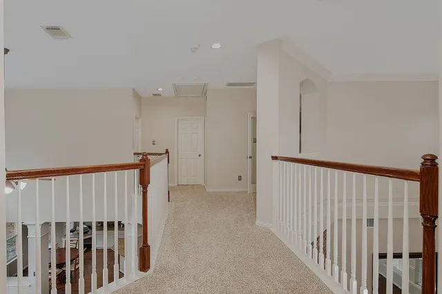 a view of hallway with wooden floor