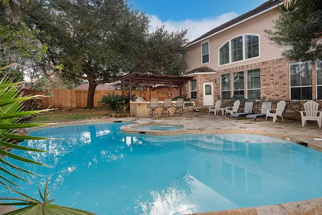a front view of a house with swimming pool