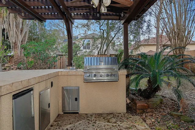 a view of outdoor kitchen and outdoor space