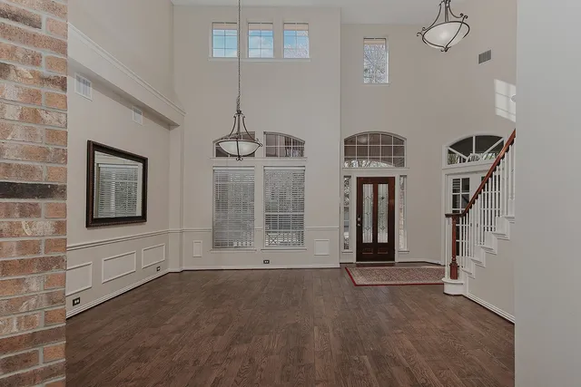a view of an entryway with wooden floor
