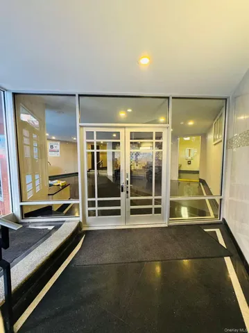 a room with gym equipment and a large window