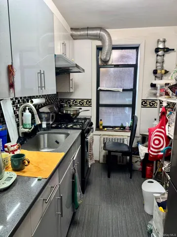 a room with furniture a rug and a wooden floor