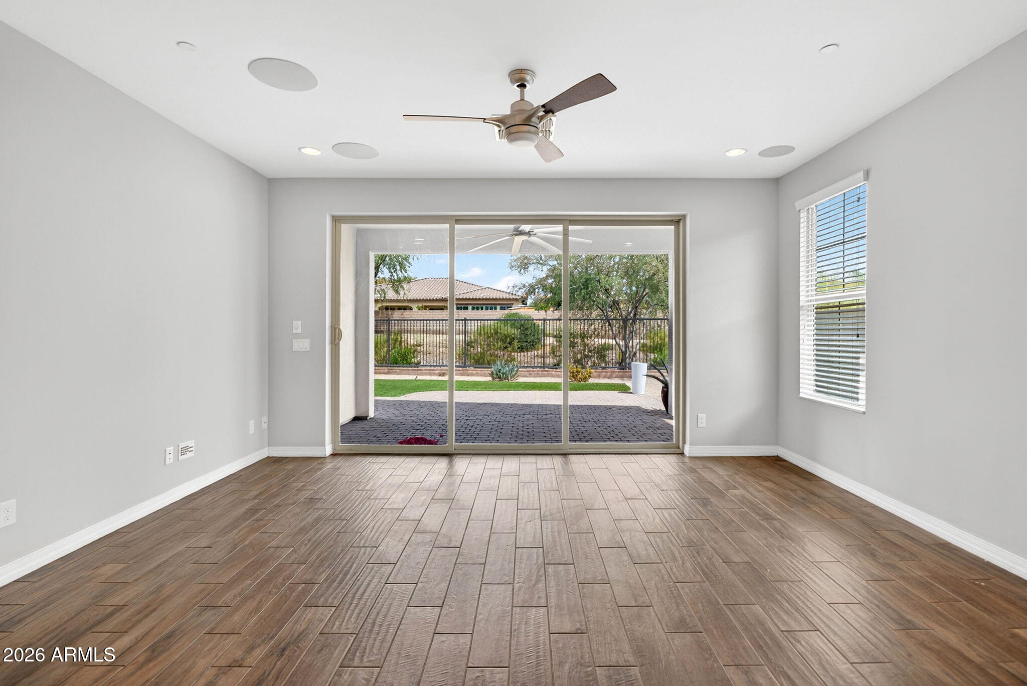 12124 West Peak View Road Peoria, AZ 85383 - Photo 10 of 38 a view of an empty room with a window