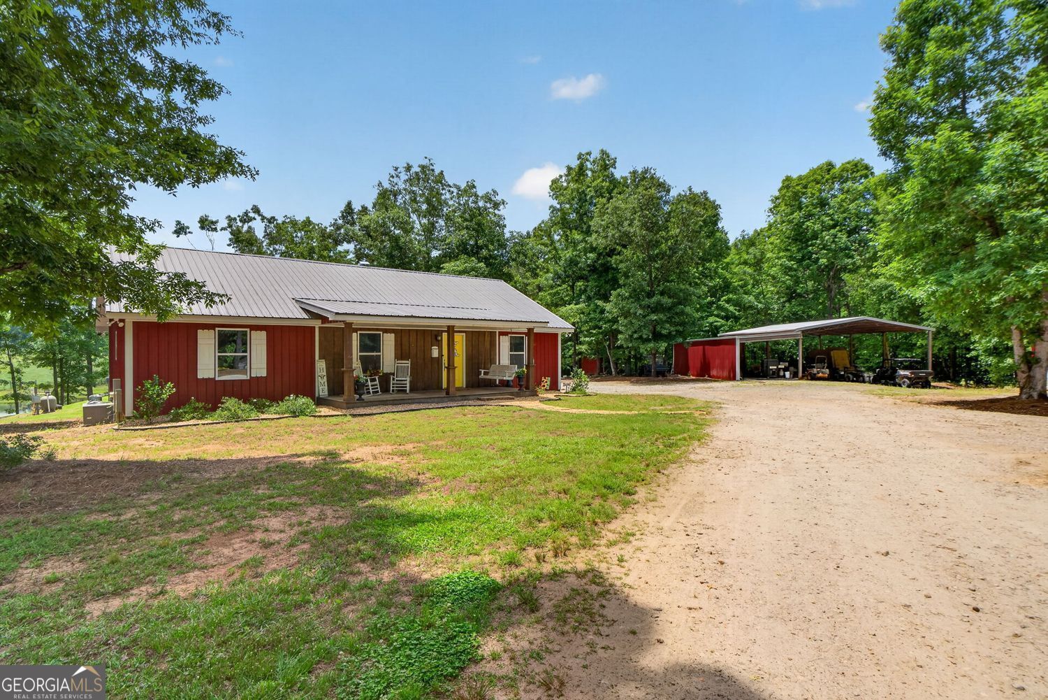 454 Tom Bell Road Milner, GA 30257 - Photo 1 of 53 a front view of house with yard and trees in the background