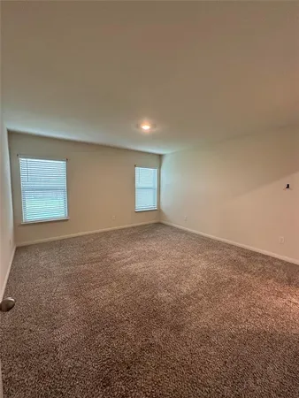 a view of a house with a big yard and large trees