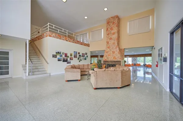 a living room with furniture and stairs