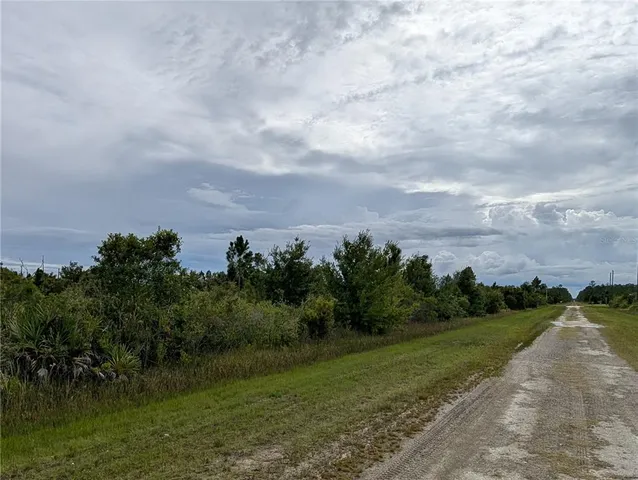 a view of a lake with a yard
