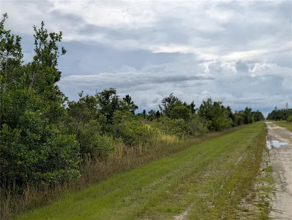 a view of a lake with a yard