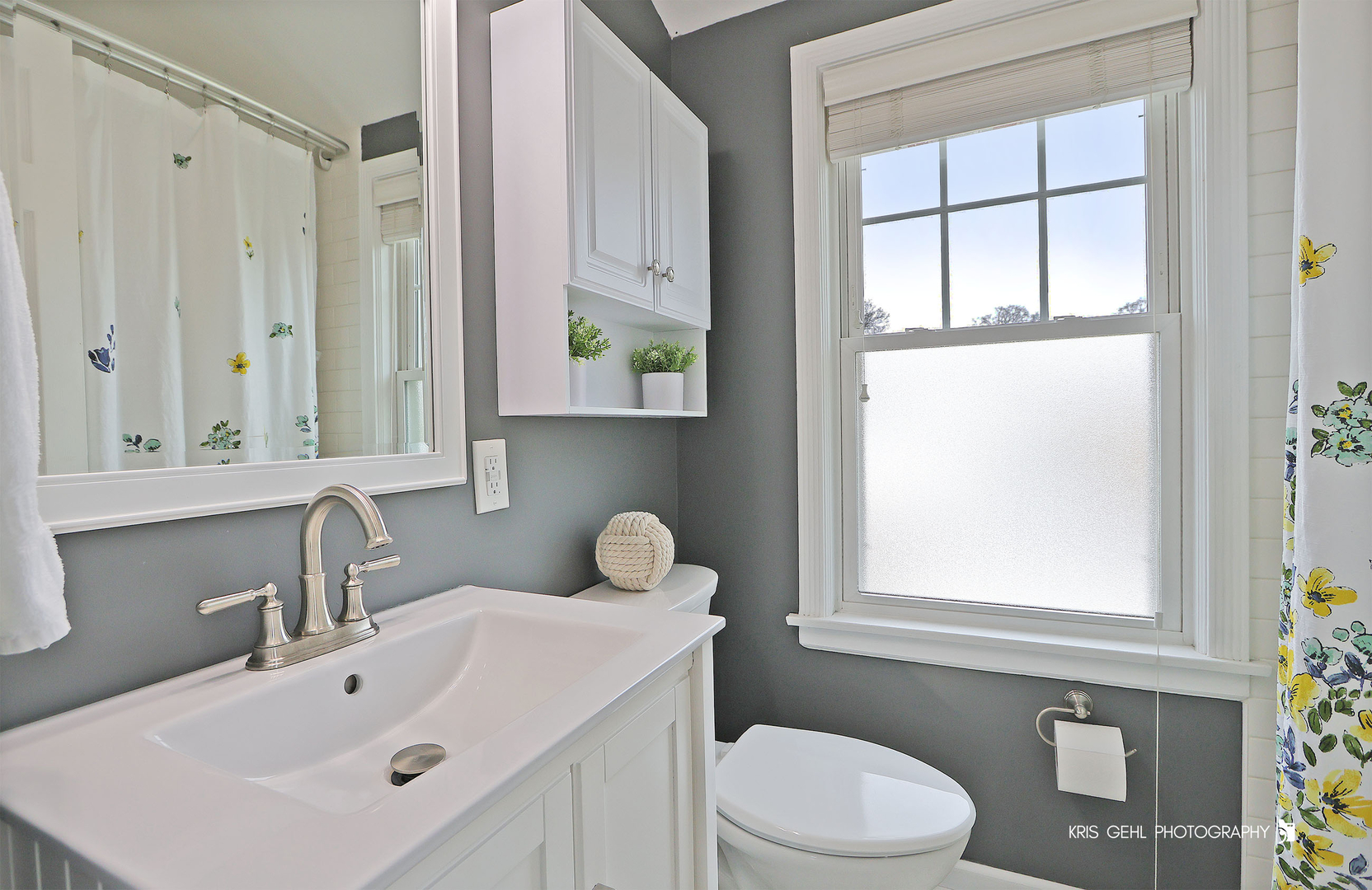 956 Spring Road Elmhurst, IL 60126 - Photo 12 of 26 a bathroom with a sink a toilet and a window