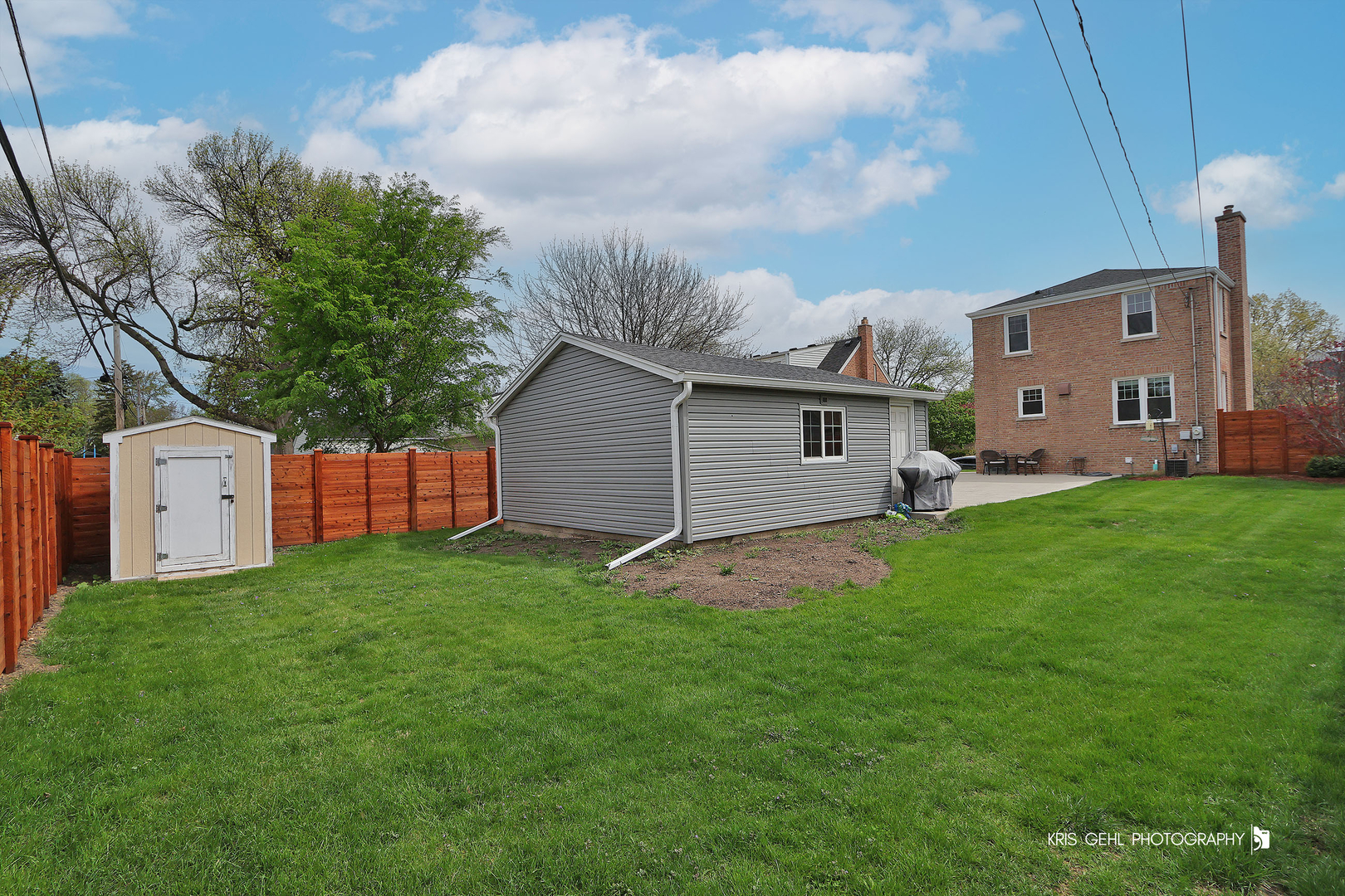 956 Spring Road Elmhurst, IL 60126 - Photo 19 of 26 a backyard of a house with table and chairs