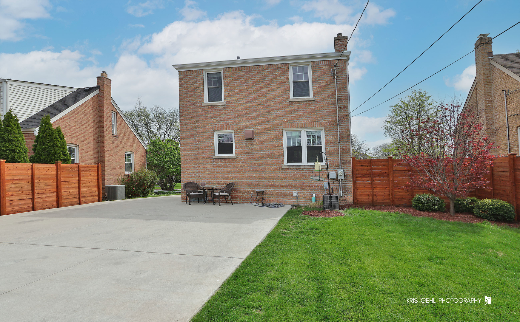 956 Spring Road Elmhurst, IL 60126 - Photo 25 of 26 a view of a backyard with table and chairs and large tree