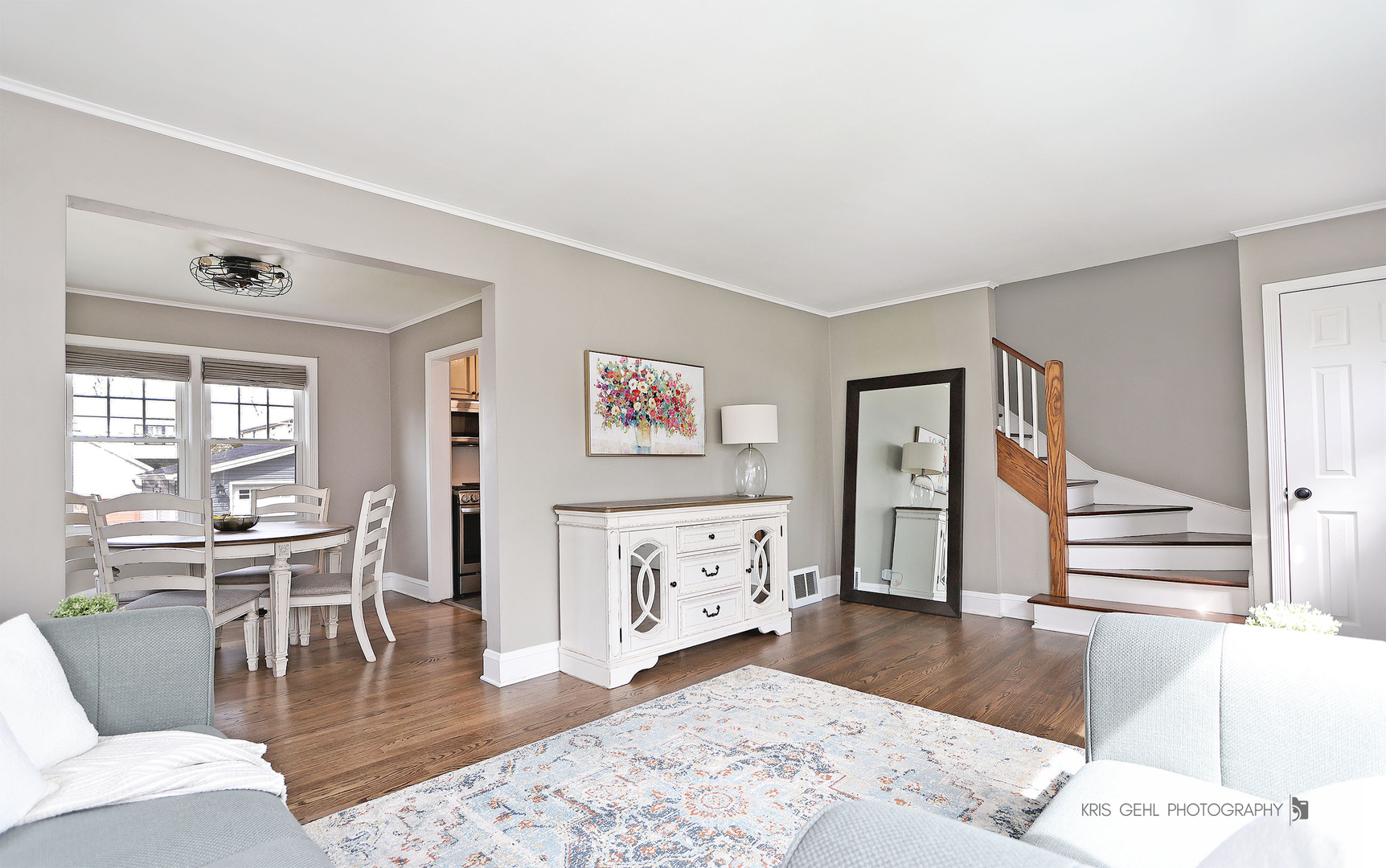 956 Spring Road Elmhurst, IL 60126 - Photo 3 of 26 a living room with furniture a dining table and wooden floor