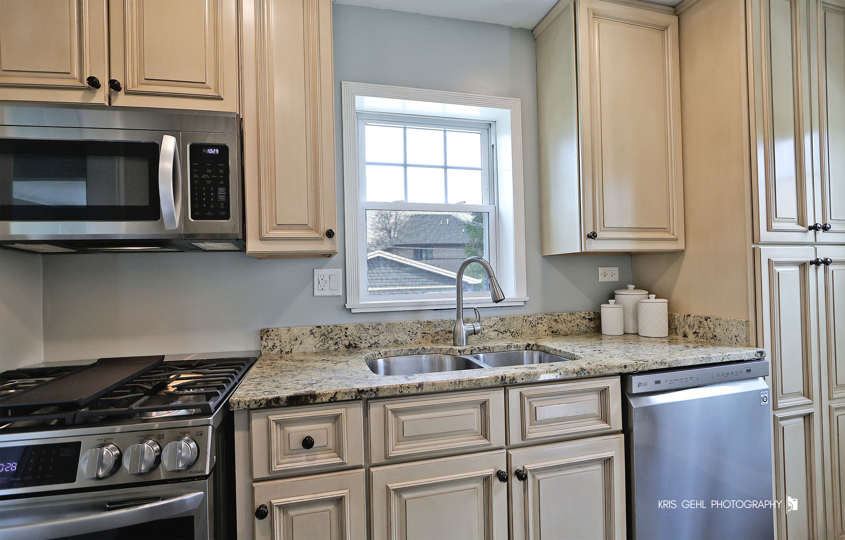 956 Spring Road Elmhurst, IL 60126 - Photo 7 of 26 a kitchen with granite countertop a stove and a sink
