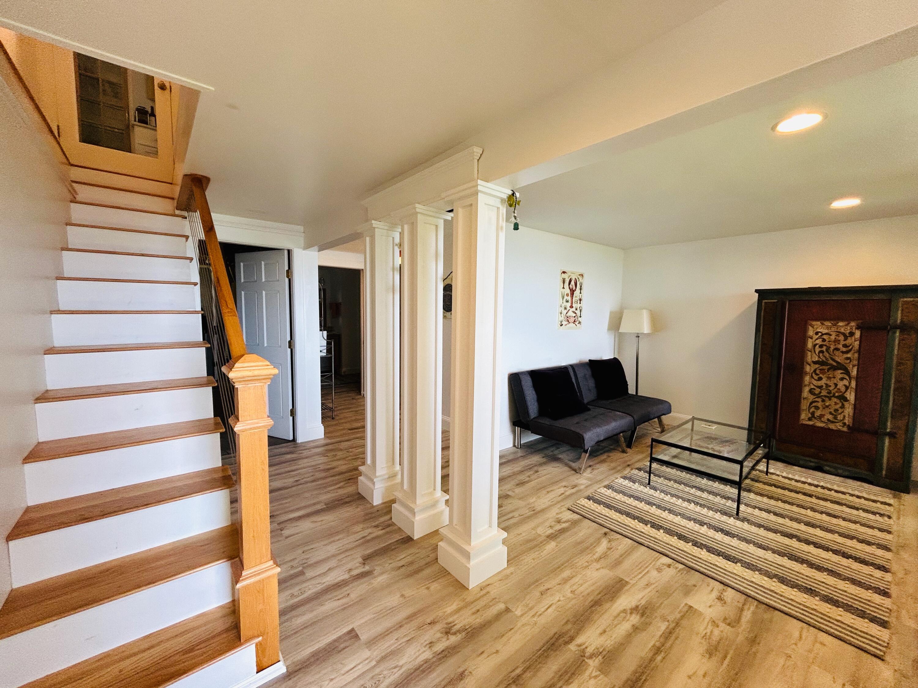 301 Paul Bunyan Road Corea, ME 04624 - Photo 29 of 35 Basement LR and stairs