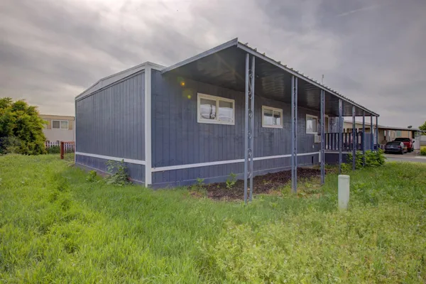 a view of backyard with green space