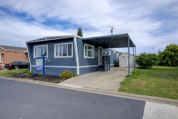 a house view with a garden space